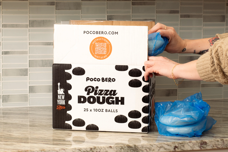 Poco Bero pizza dough box being unpacked